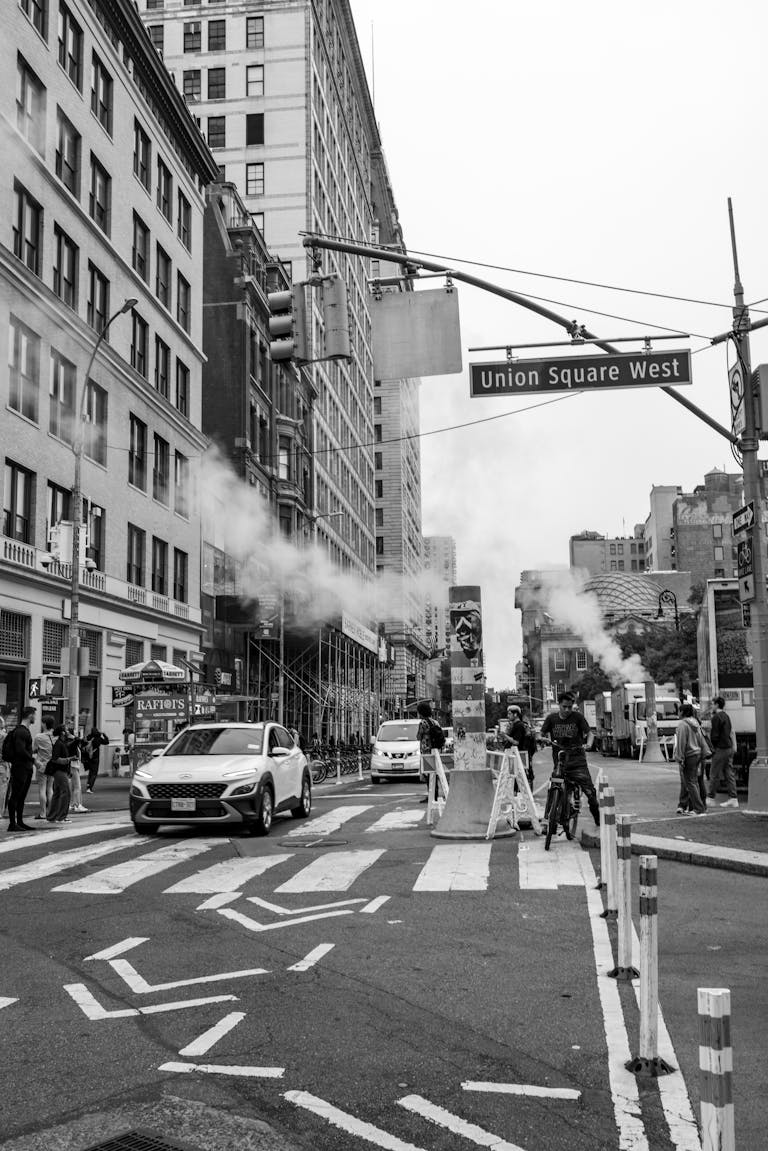 Classic black and white scene at Union Square, NYC, featuring urban life and architecture.