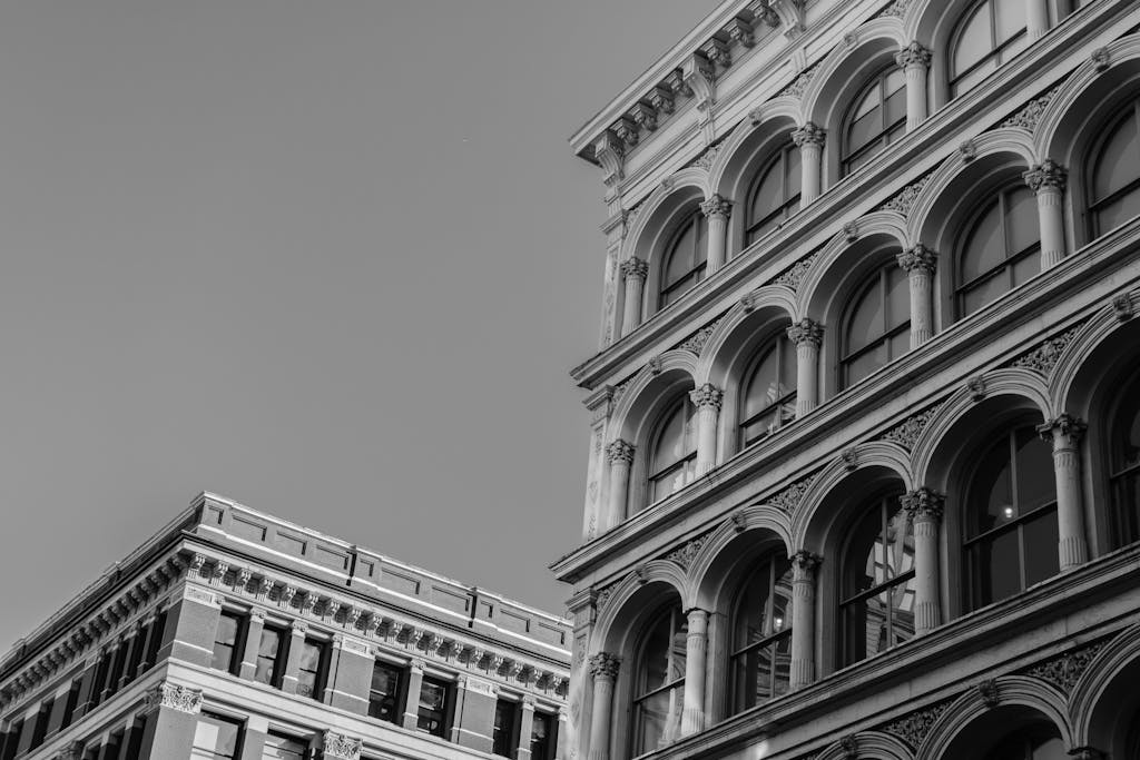 Black and white photo of historic New York architecture with detailed facades.