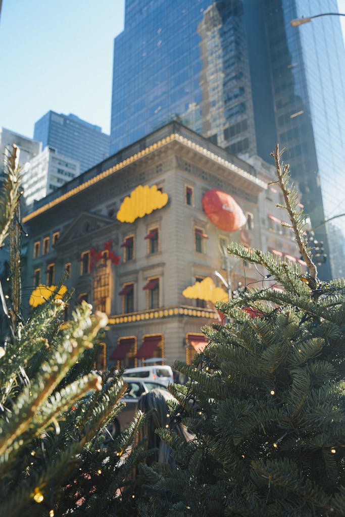 Decorated building with Christmas trees in New York City, reflecting a festive ambiance.