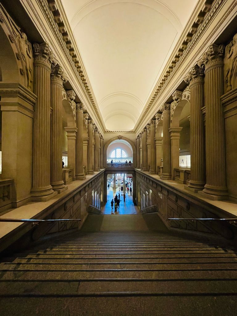 Elegant interior view of the Metropolitan Museum of Art in New York City, showcasing its grand architecture.